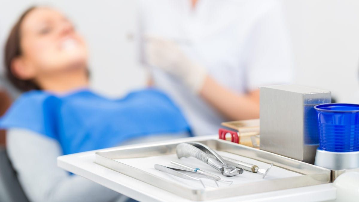 Woman being prepped for oral surgery