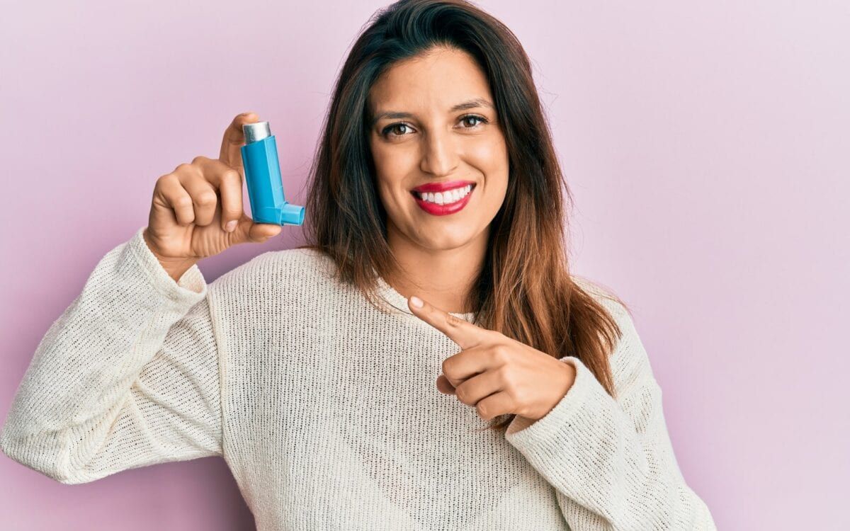 Woman holding inhaler