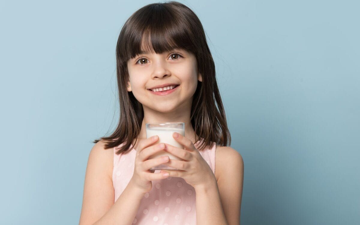 Child with glass of milk