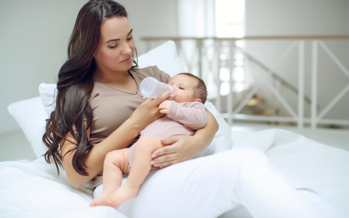 Woman bottlefeeding her child