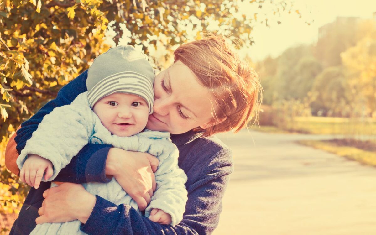 Mother and baby during autumn